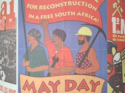 A "May Day" or "Worker's Day" poster inside the IISH building. The holiday celebrates the role trade unions and other labour movements played in equal employment standards in South Africa.  Photo Credit: Meera Venkatachalam