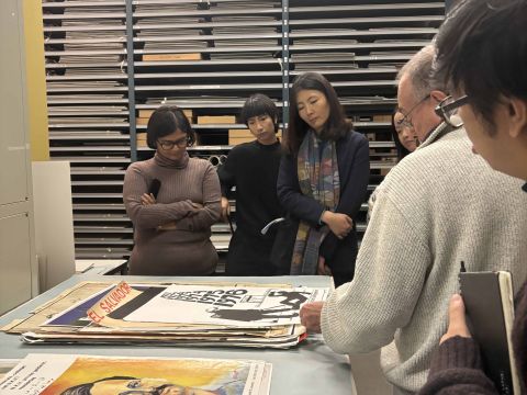 IIAS Fellows looking at archived posters from various social movements around the world.   Photo Credit: Sarah Niazi