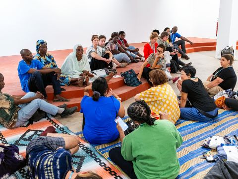 Participants of both dyeing workshops at IFAN Museum, Dakar, Senegal discussing and listening to the background behind the workshop.
