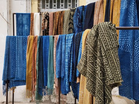 A collection of indigo and bogolon cloth samples from Idrissa's textile business.